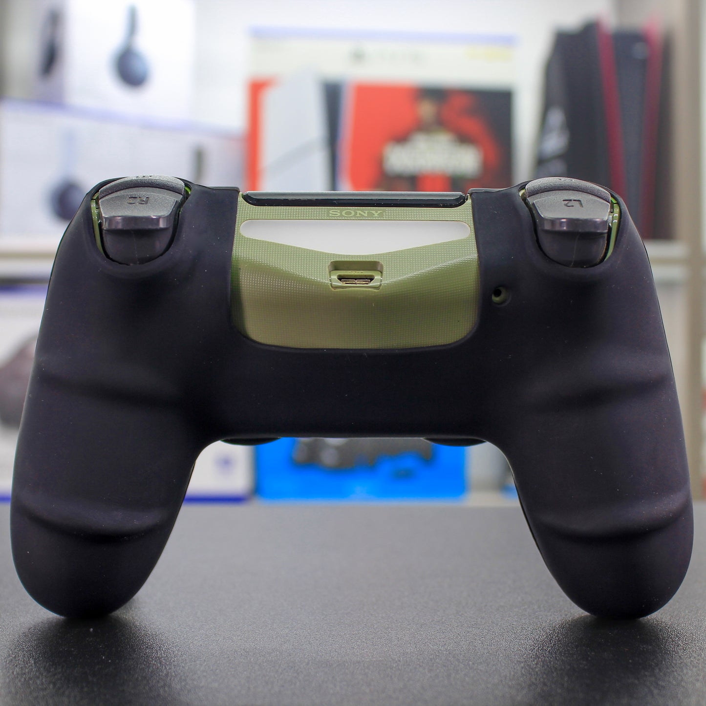 Cover de silicón negro con verde para mando de PS4
